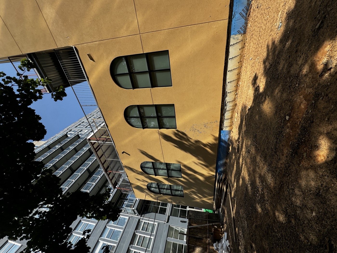 Dark dated stucco home before