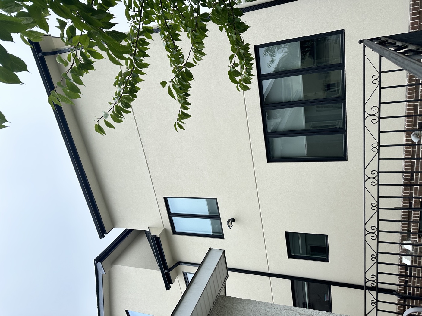 Damaged stucco chimney before