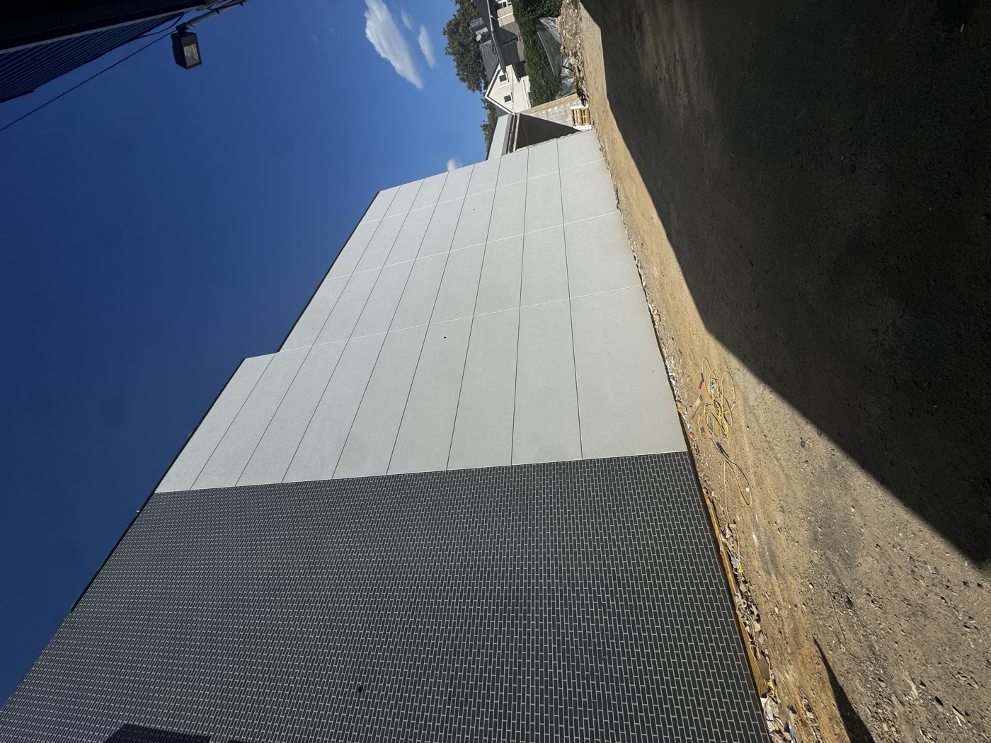 Old brick building before stucco