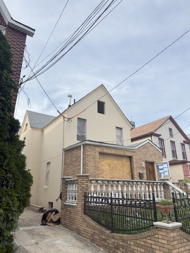 New construction stucco on a rear gable elevation in Brooklyn